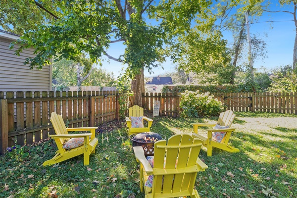 Gather, unwind, repeat—our South Bend retreat features Adirondack chairs and a wood-burning firepit, perfect for family-friendly evenings near Notre Dame. S’mores await.