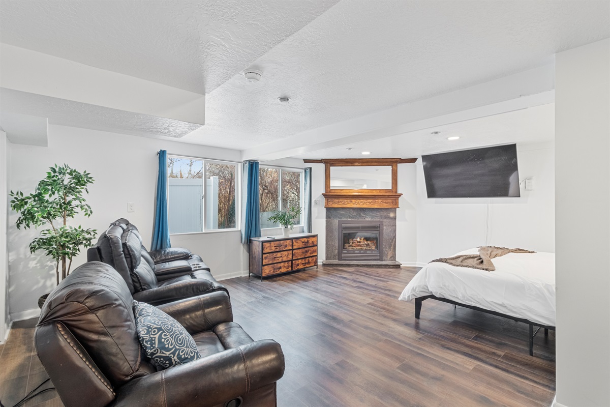 Lounge seats, recliner, gas fireplace, and a 65 in TV, and a king size bed, what more can you ask for?