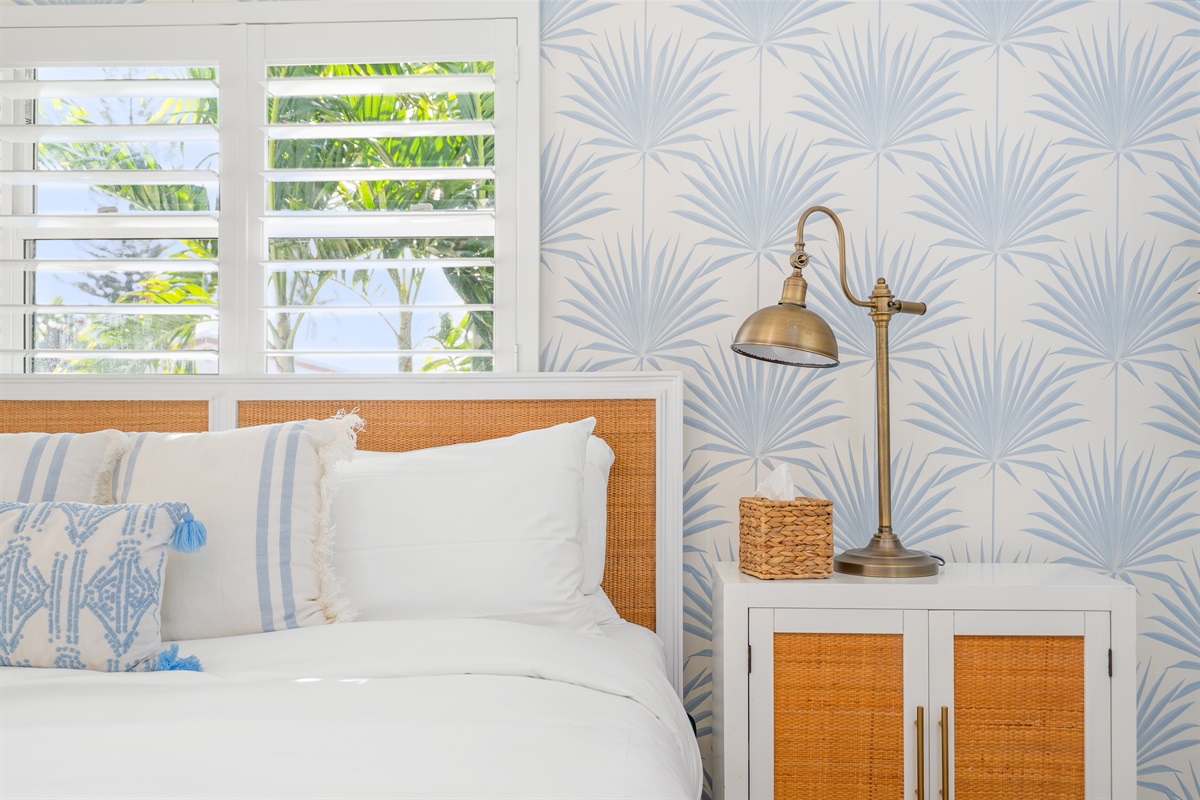 Thoughtful details and designer lighting by every bedside.