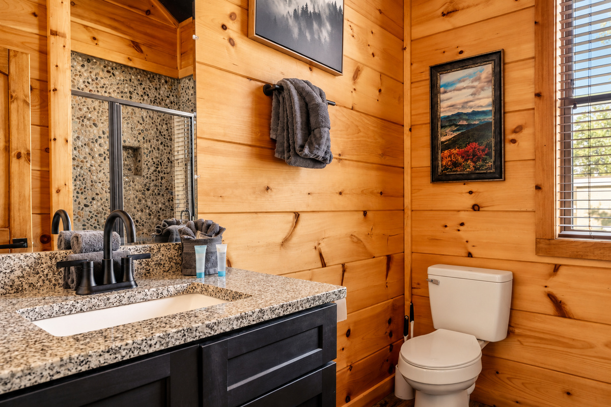 Pine-paneled walls and mountain art make getting ready feel like a mini retreat.