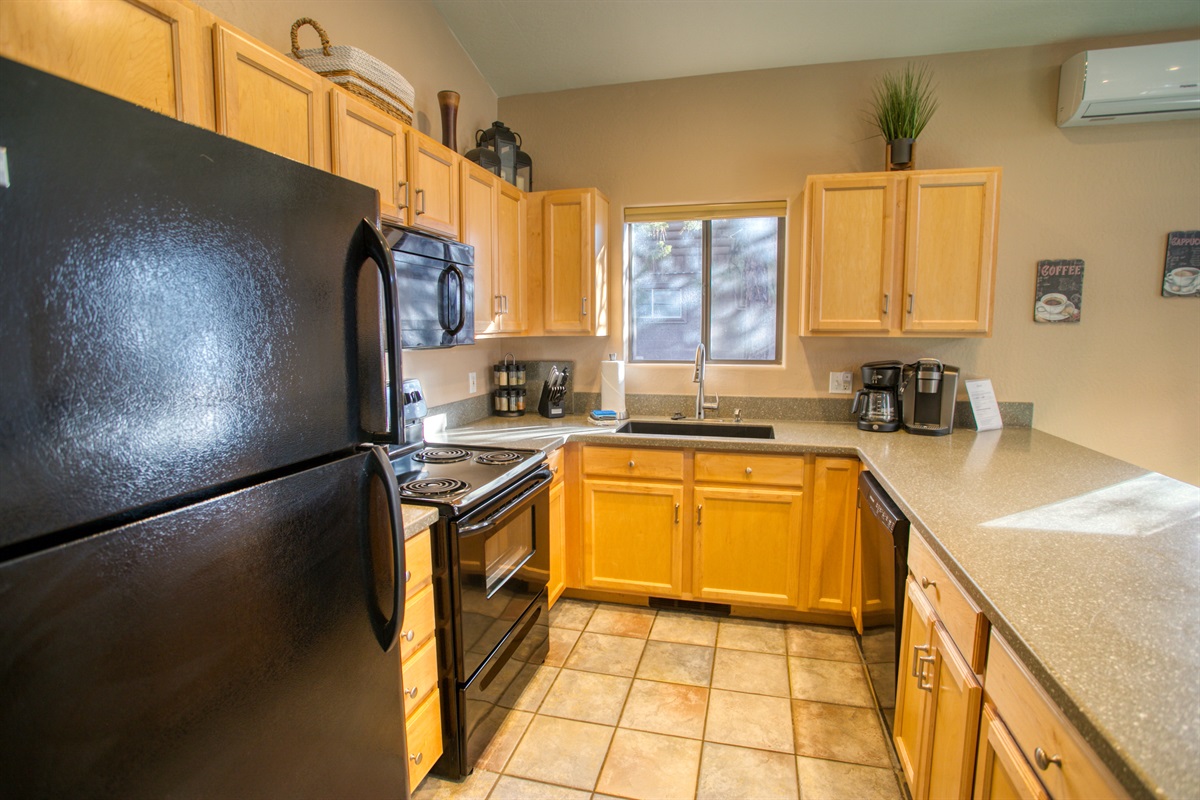 Spacious, well-stocked kitchen perfect for shared meals and cozy mornings. (
