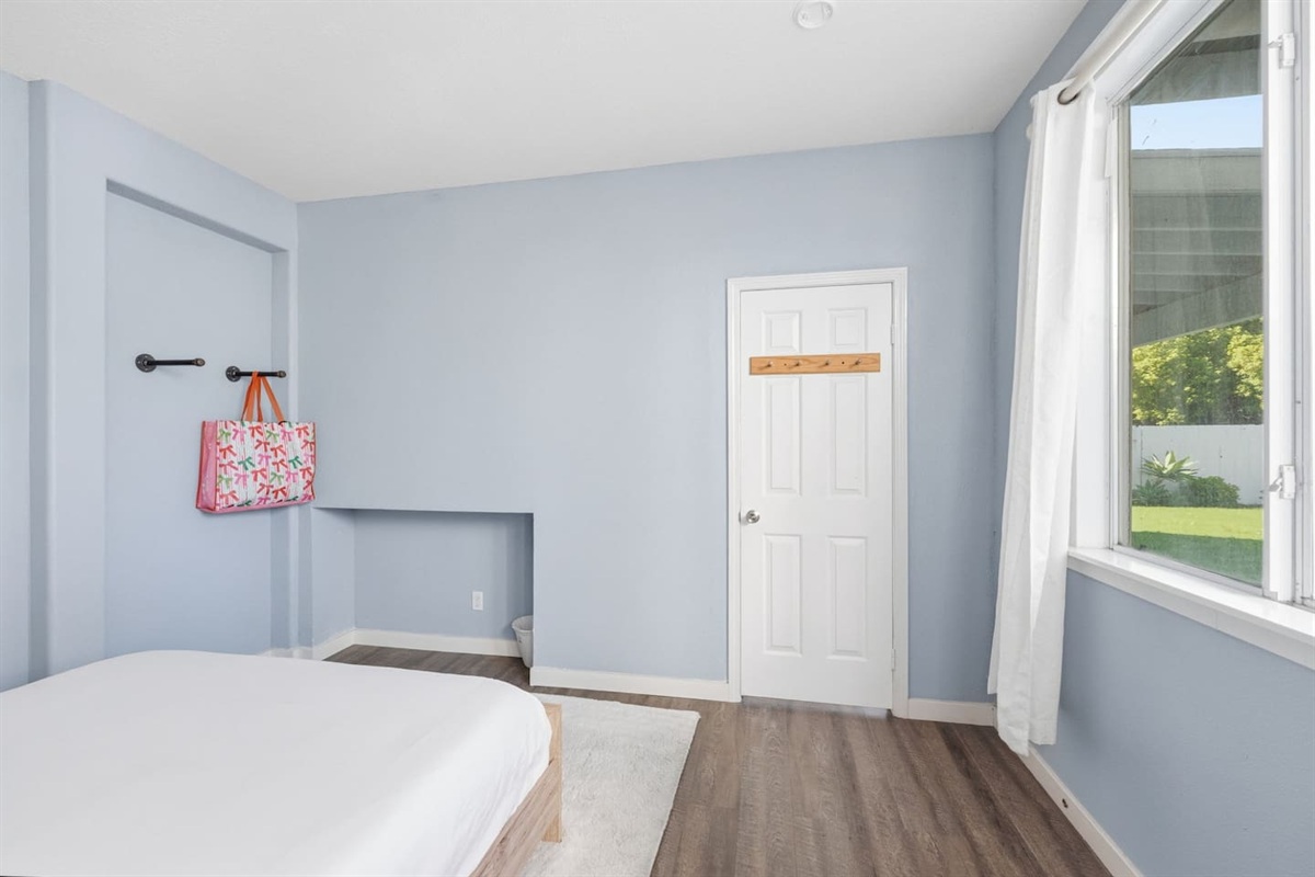 Full bed with fresh bed linens, room-darkening shades, and hangar space. Private, quiet sleeping space for couples or solo guests.