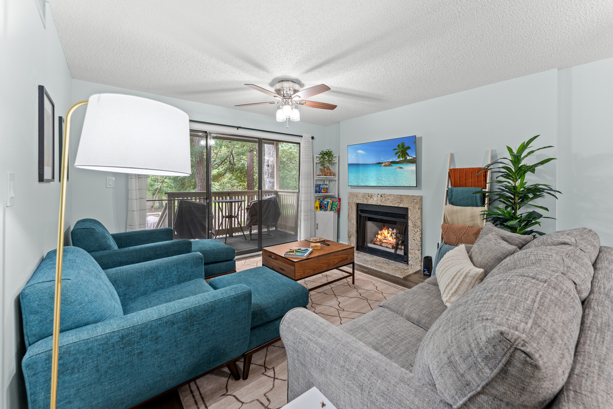Living room w/ updated decor and fireplace 