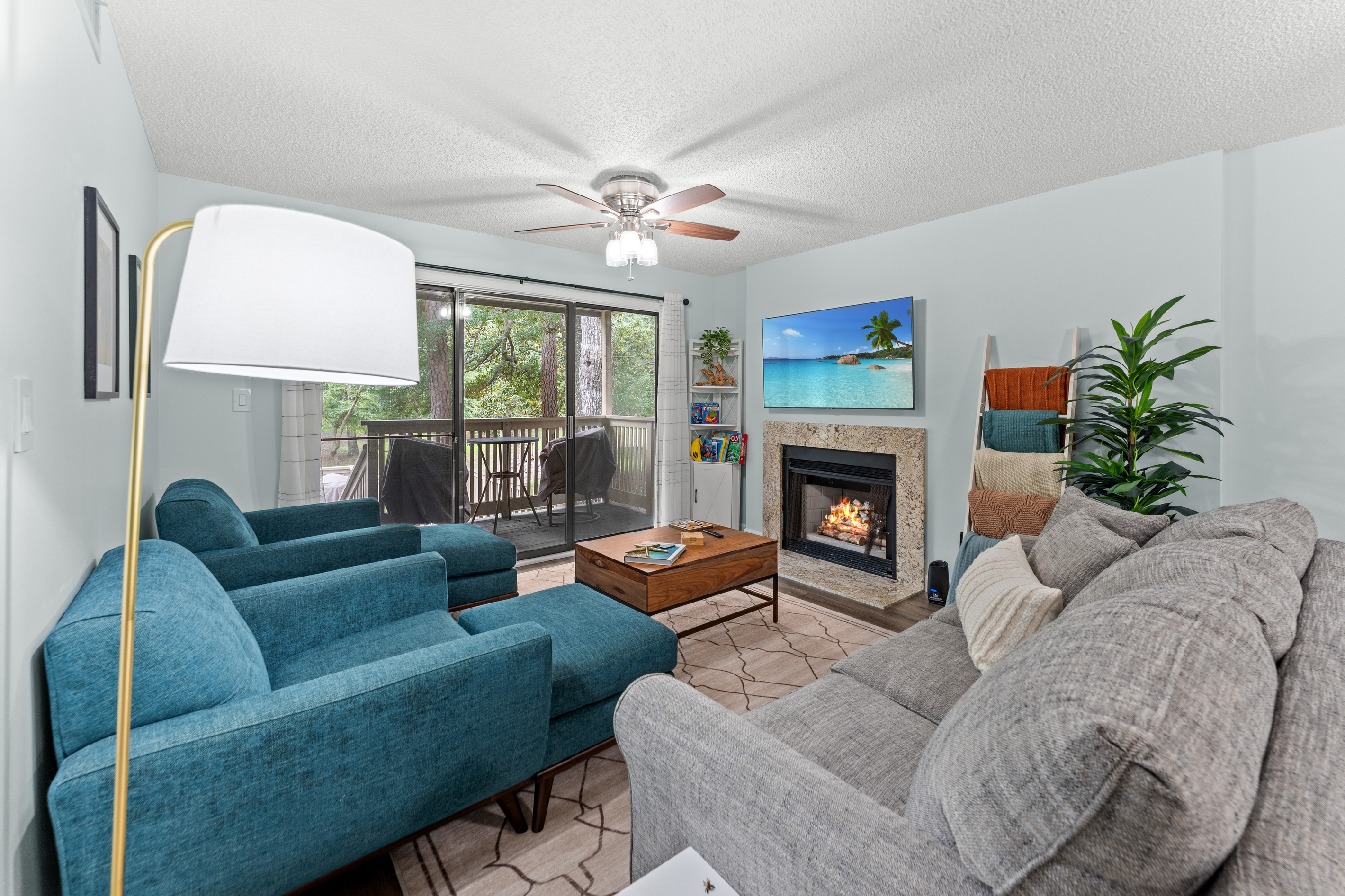 Living room w/ updated decor and fireplace 