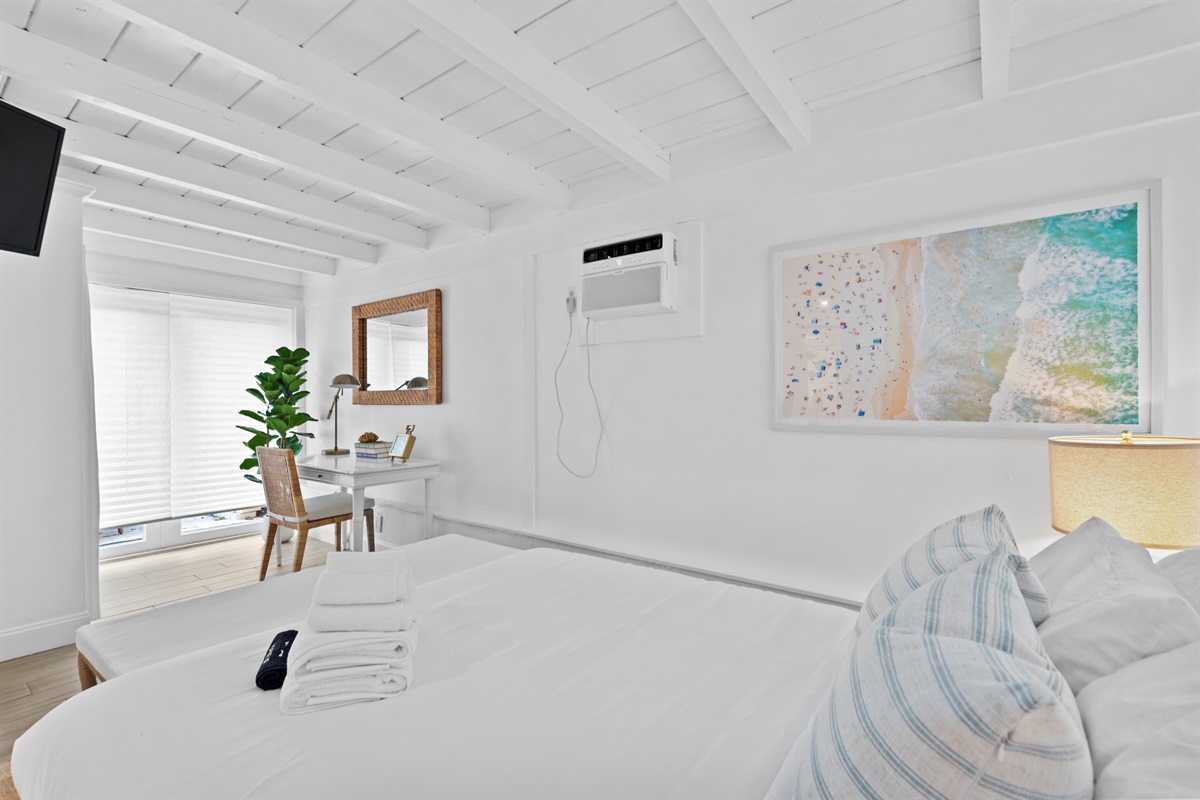 Sunlit spaces and beach-inspired artwork bring relaxed Florida elegance indoors.