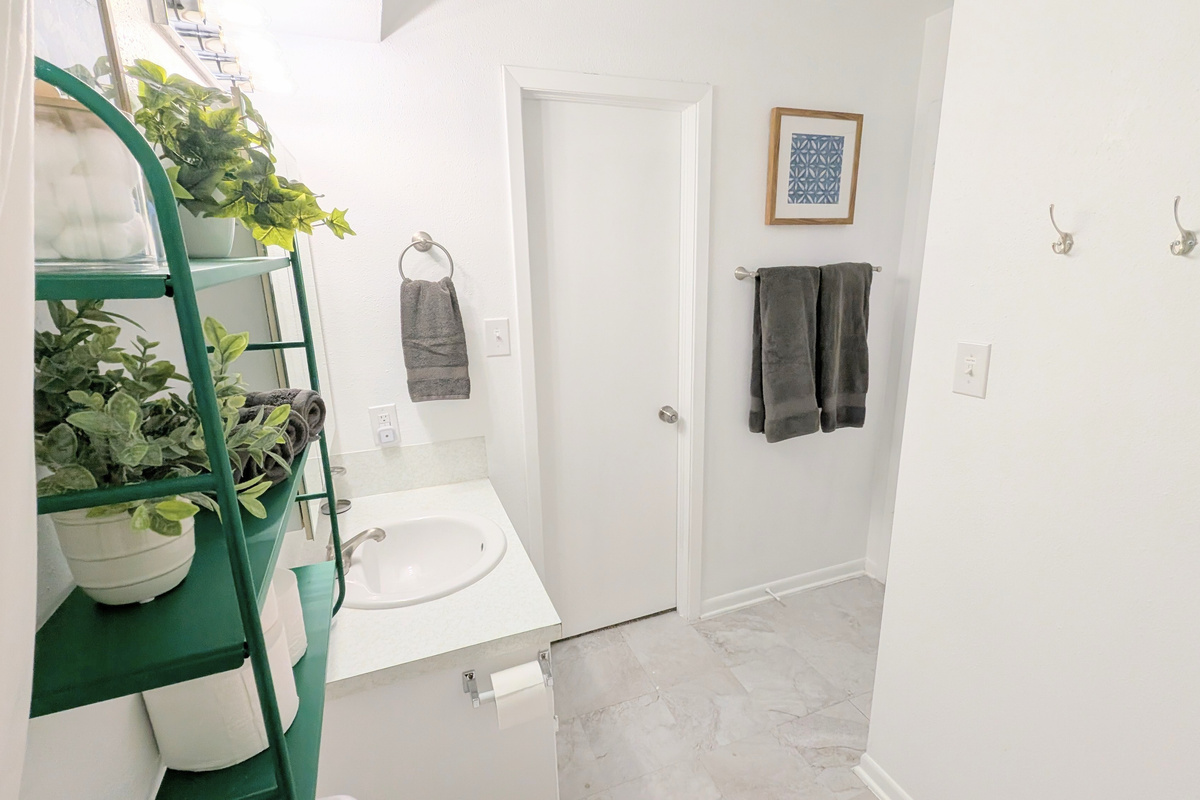 Get ready in this clean and stocked bathroom. 
