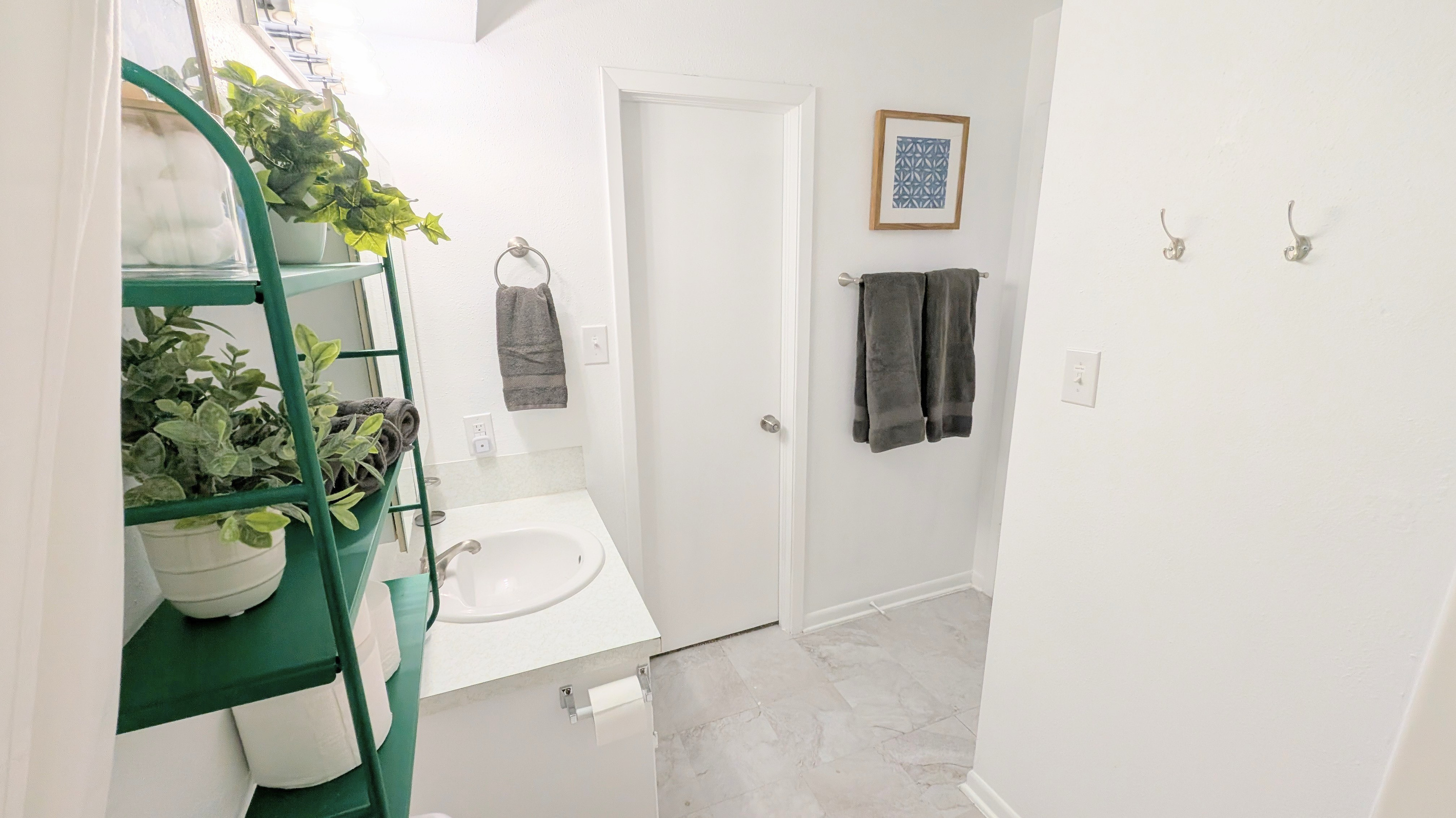 Get ready in this clean and stocked bathroom. 