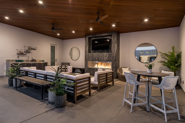 Outdoor covered lounge - with fireplace, TV, bistro table, couch, bathroom, wet bar, papasans and spa access