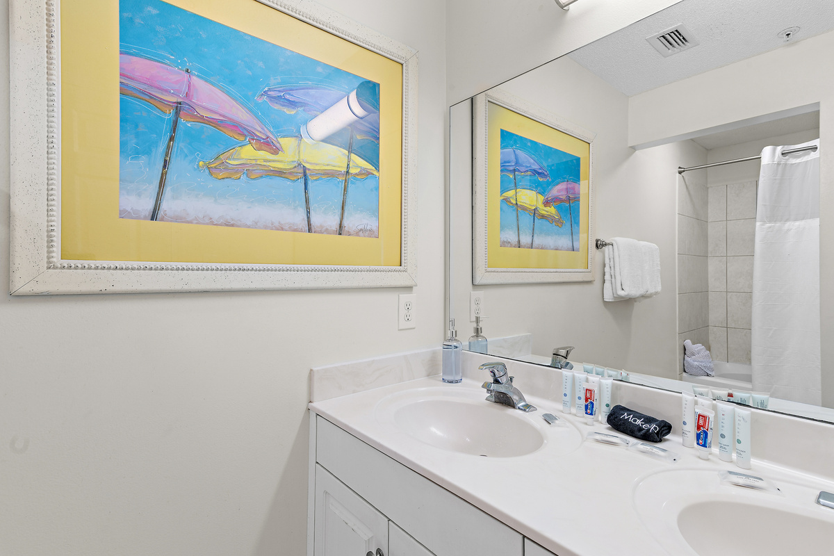 Primary bedroom which features a King Bed, new furniture, Smart TV, large closet, and private bathroom with dual vanity