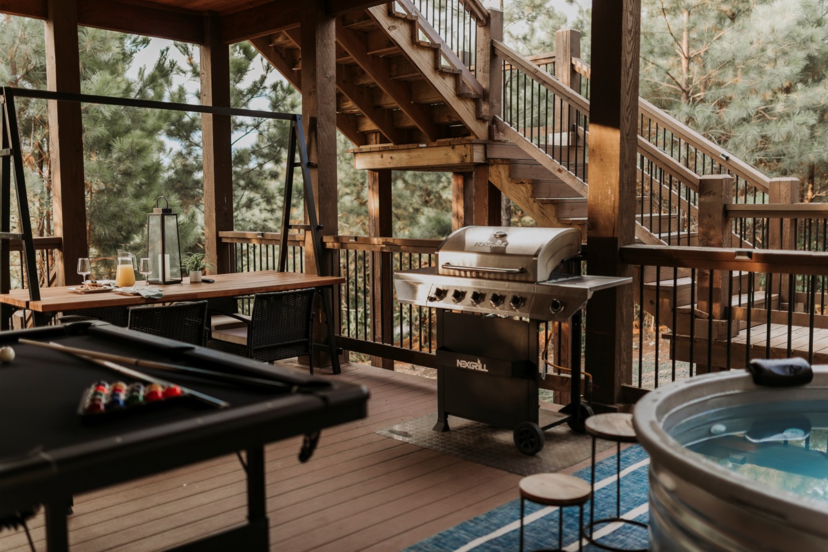 Outdoor amenities under 2 covered decks you'll LOVE: soak in the hot tub, fire up the grill, or shoot a game of pool, all while surrounded by miles of unobstructed views and privacy. 