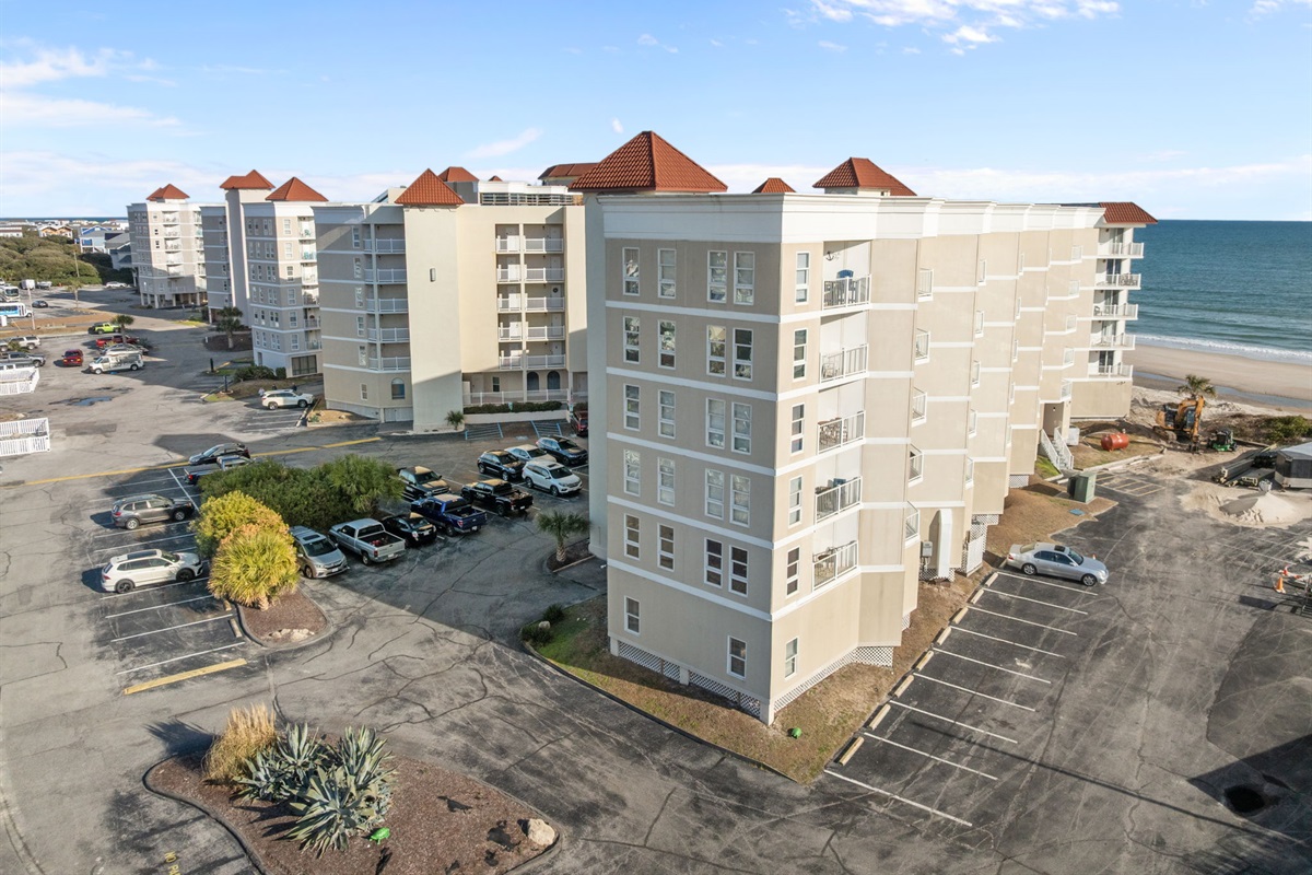 Perspective of St. Regis buildings, parking areas, and direct beachside location