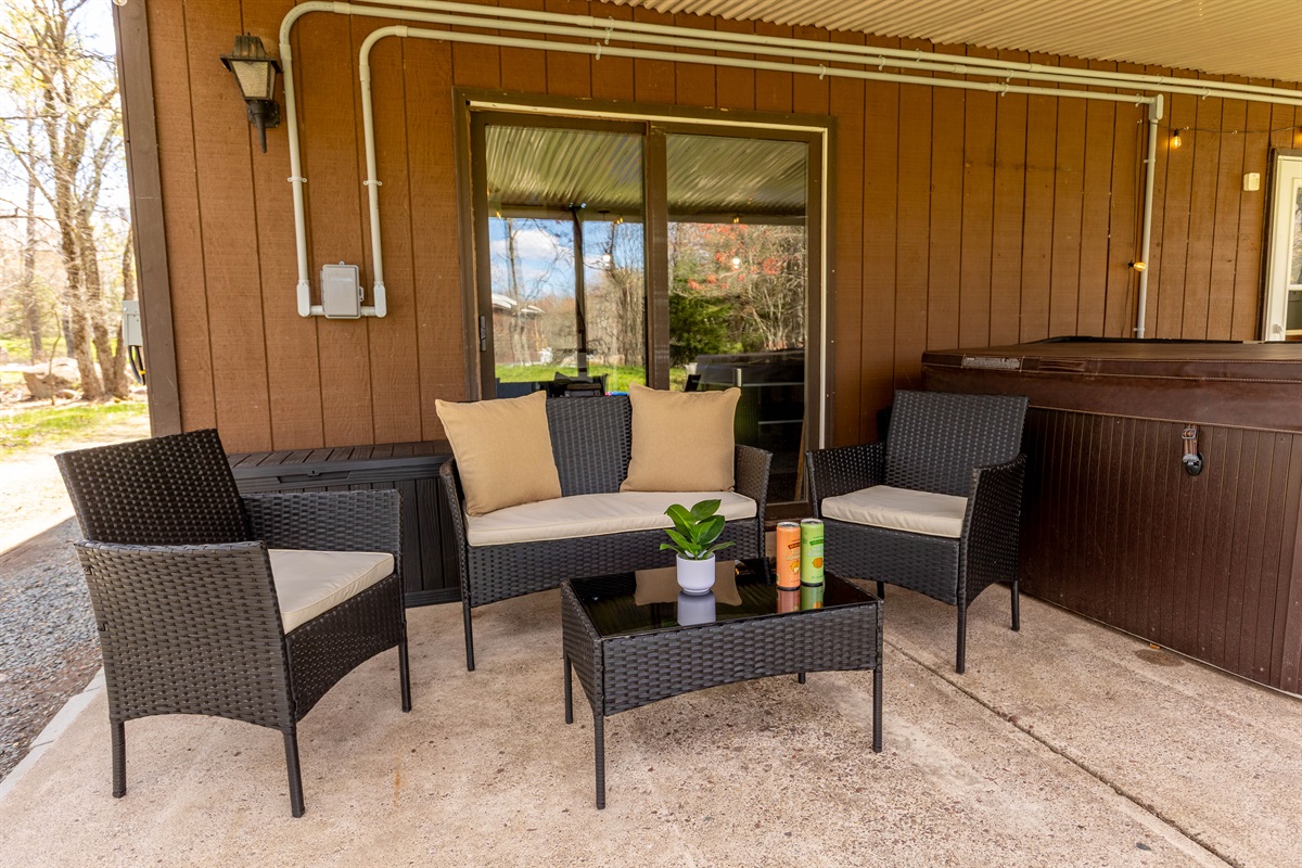 Relax in the covered patio under the deck while others enjoy the hot tub just steps away