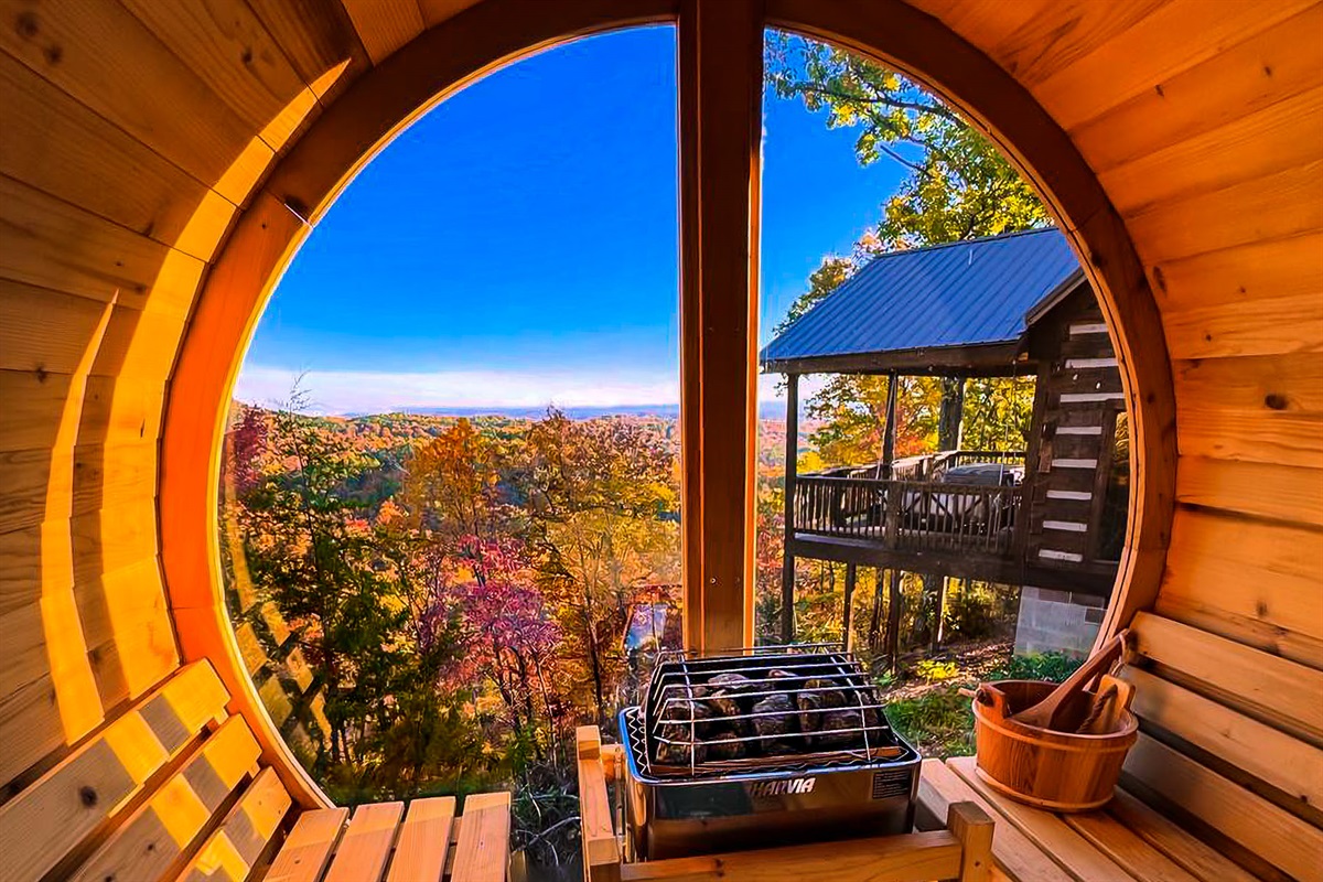 Watch the leaves change across the mountains from our glass wall barrel sauna as you relax and unwind in a peaceful escape!
