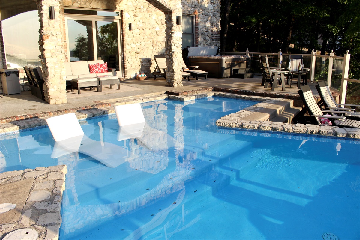 Baja reef in the pool for lounger with steps down to a 5' deep end.