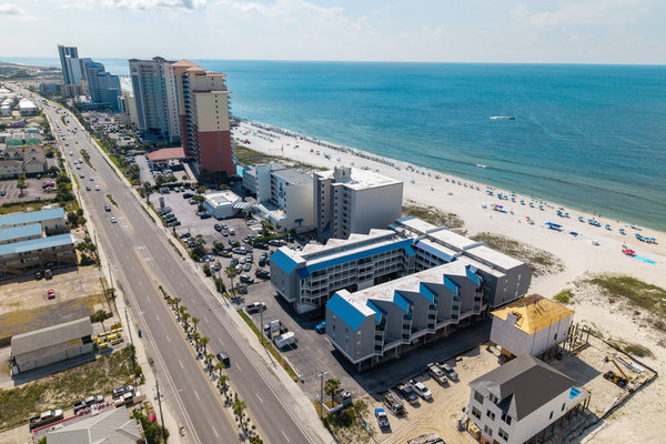 Wide aerial view of the neighborhood and beachfront strip