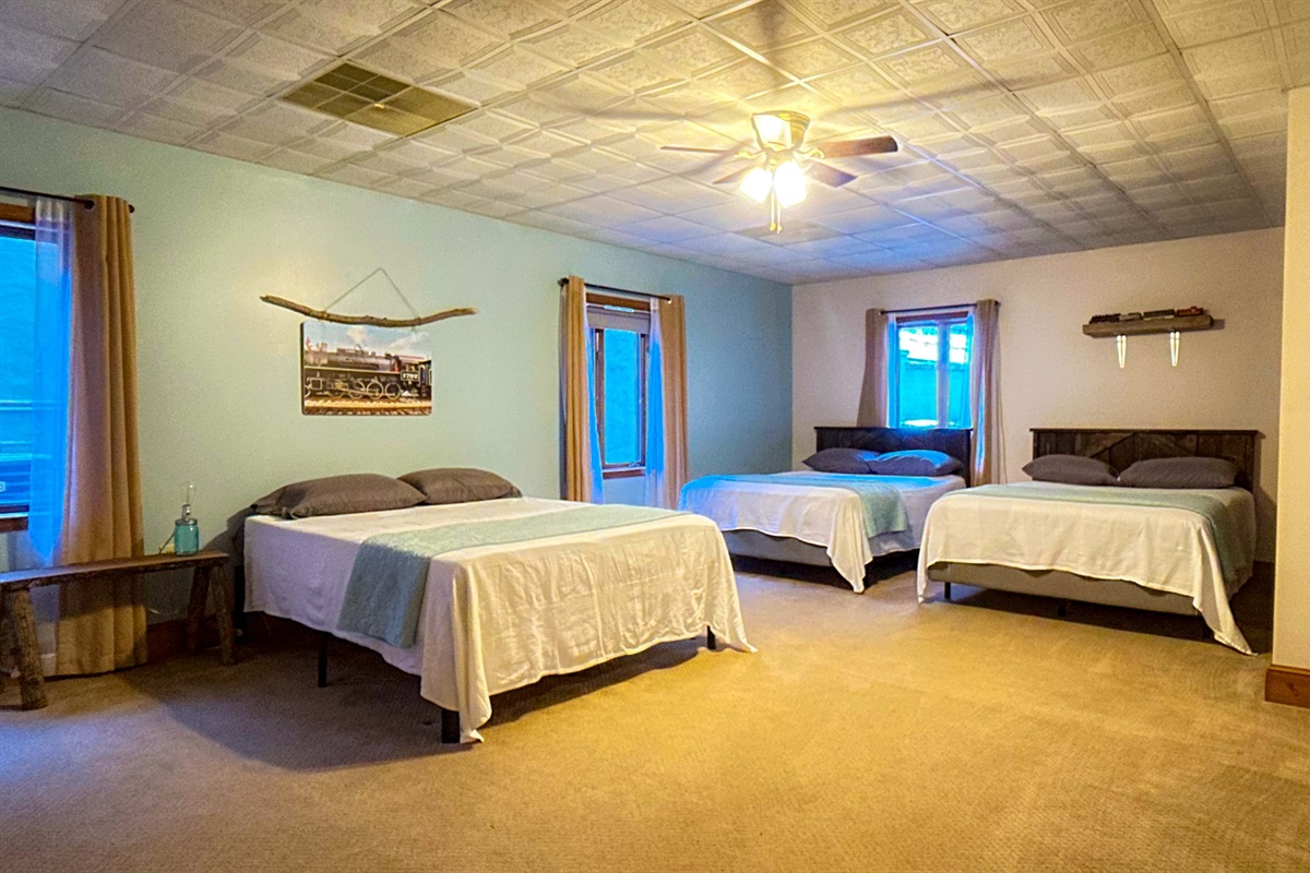 the Great Smoky Mountain Railroad themed bedroom is perfect for kiddos:) Lost of space as well even with 3 queen beds!