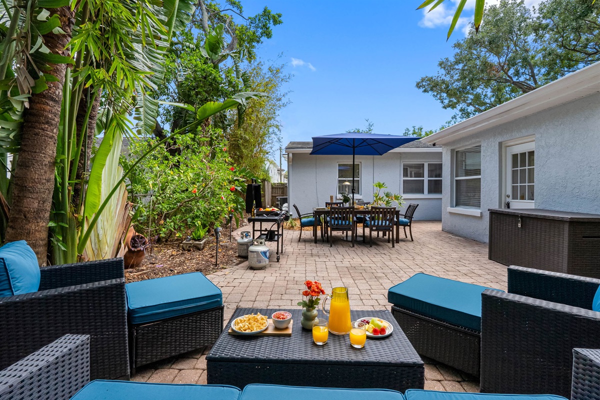 This fully furnished outdoor living area combines comfort, style, and Florida charm to create a peaceful retreat just steps from the back door.