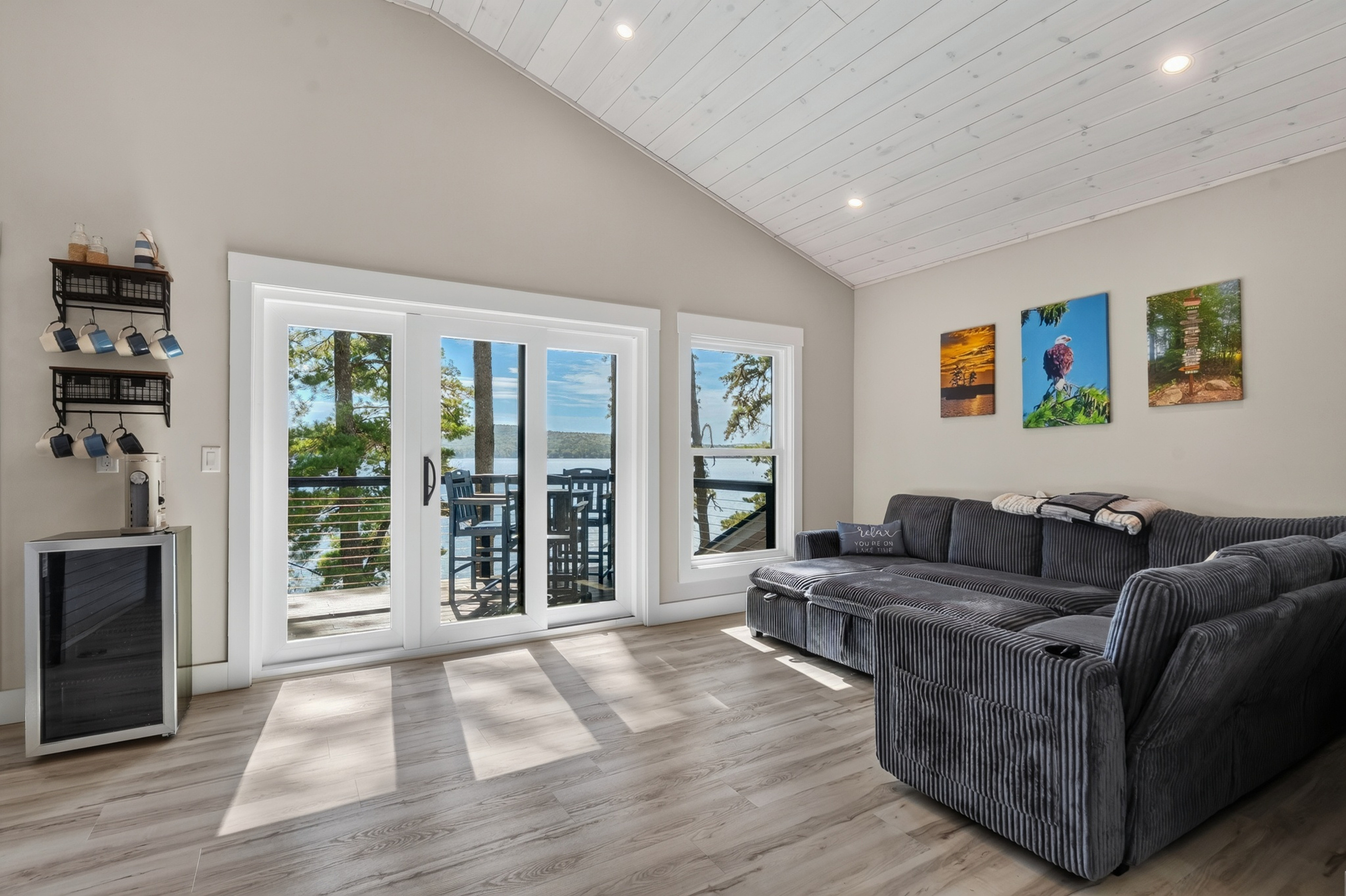 Plot twist: there’s a second living room upstairs, and it opens to its own lake-view balcony.