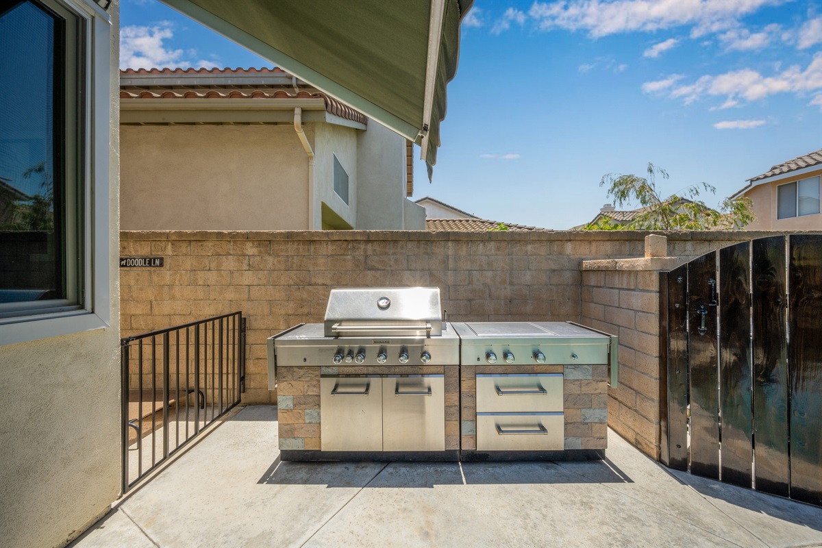 Outdoor Kitchen area, five burner Kitchen Aid grill with two side burners and searing burner.