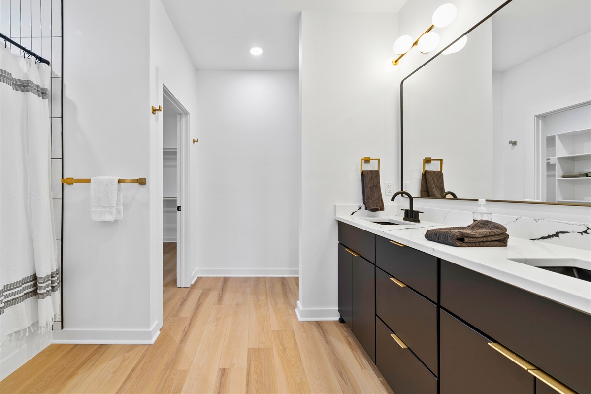 The vanity offers ample counter space, making mornings and evenings feel unhurried.