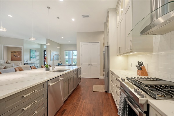 Alternate view of kitchen with top-of-the-line Jenn-Air gas stove, oven, and drawer microwave
