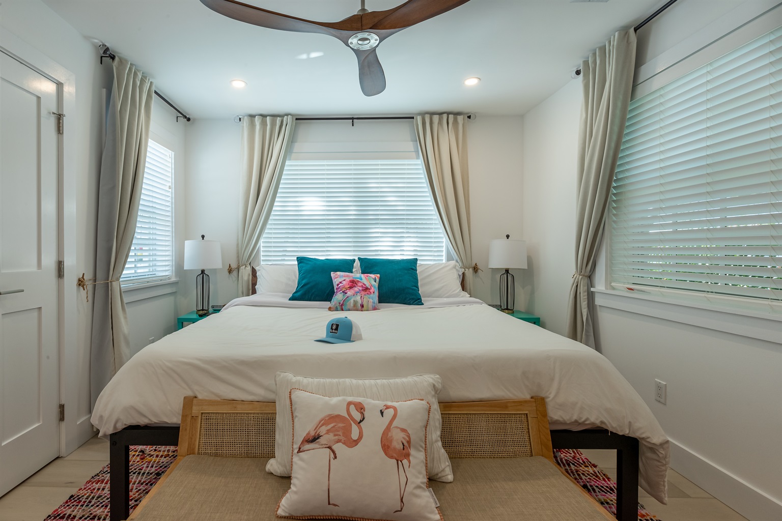 Bedroom Retreat: Vibrant decor, bright windows, and a stylish touch for your Key West getaway!