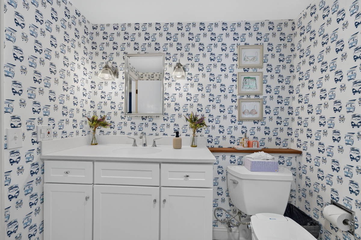 Fresh, coastal-inspired bathroom with plenty of space to get ready.