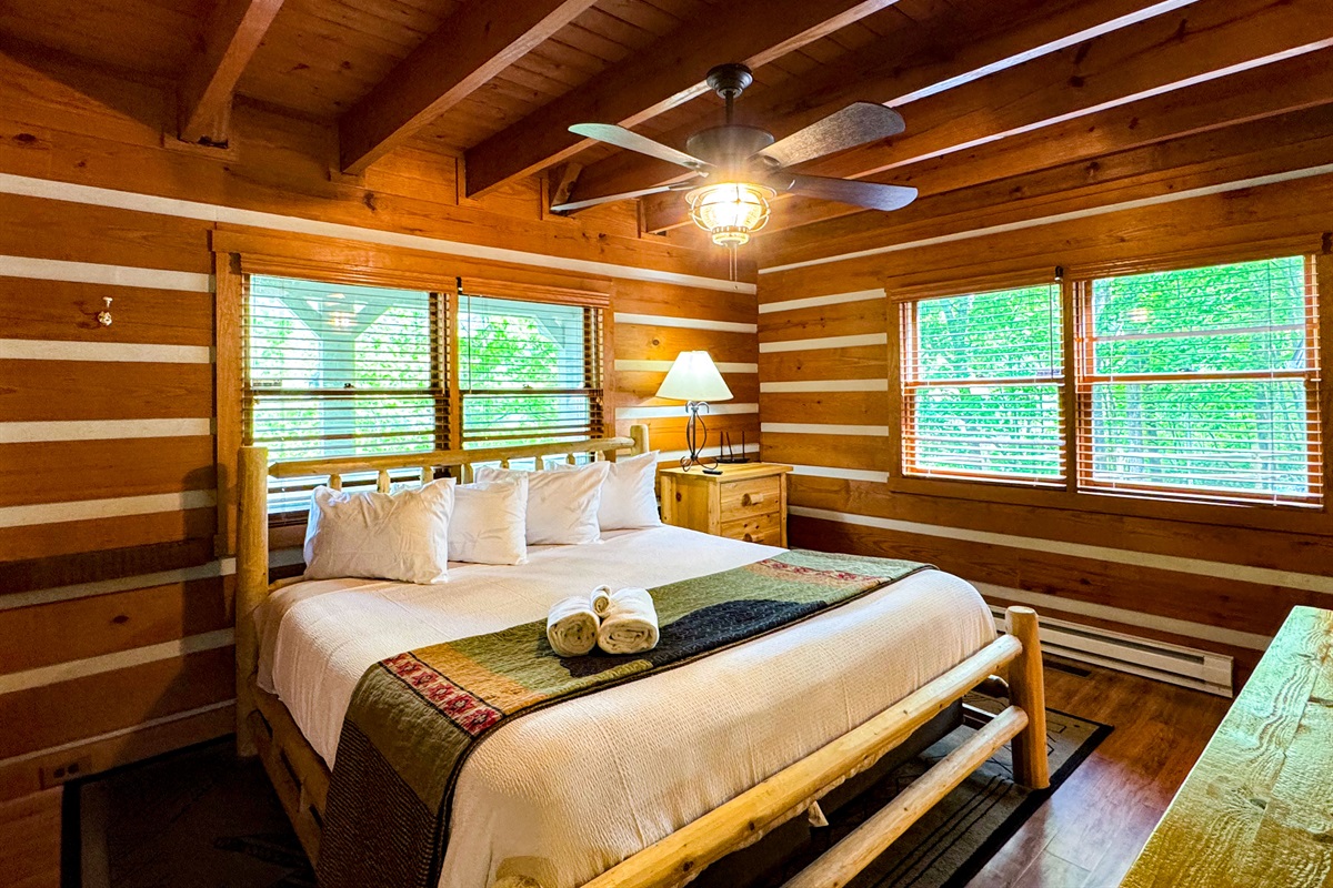 Stunning and quaint master bedroom with a king size bed, master bathroom, and 70" TV!