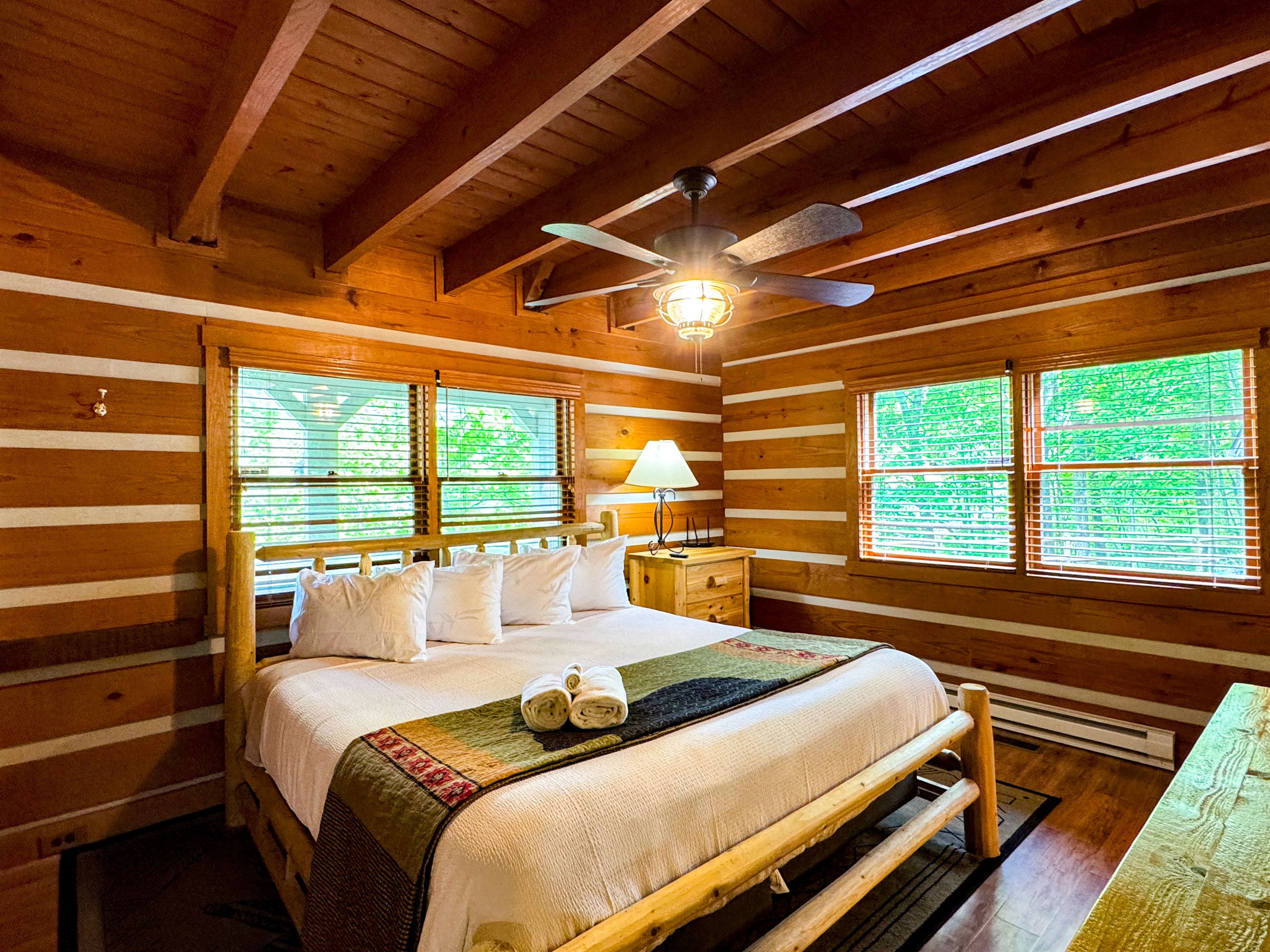 Stunning and quaint master bedroom with a king size bed, master bathroom, and 70" TV!