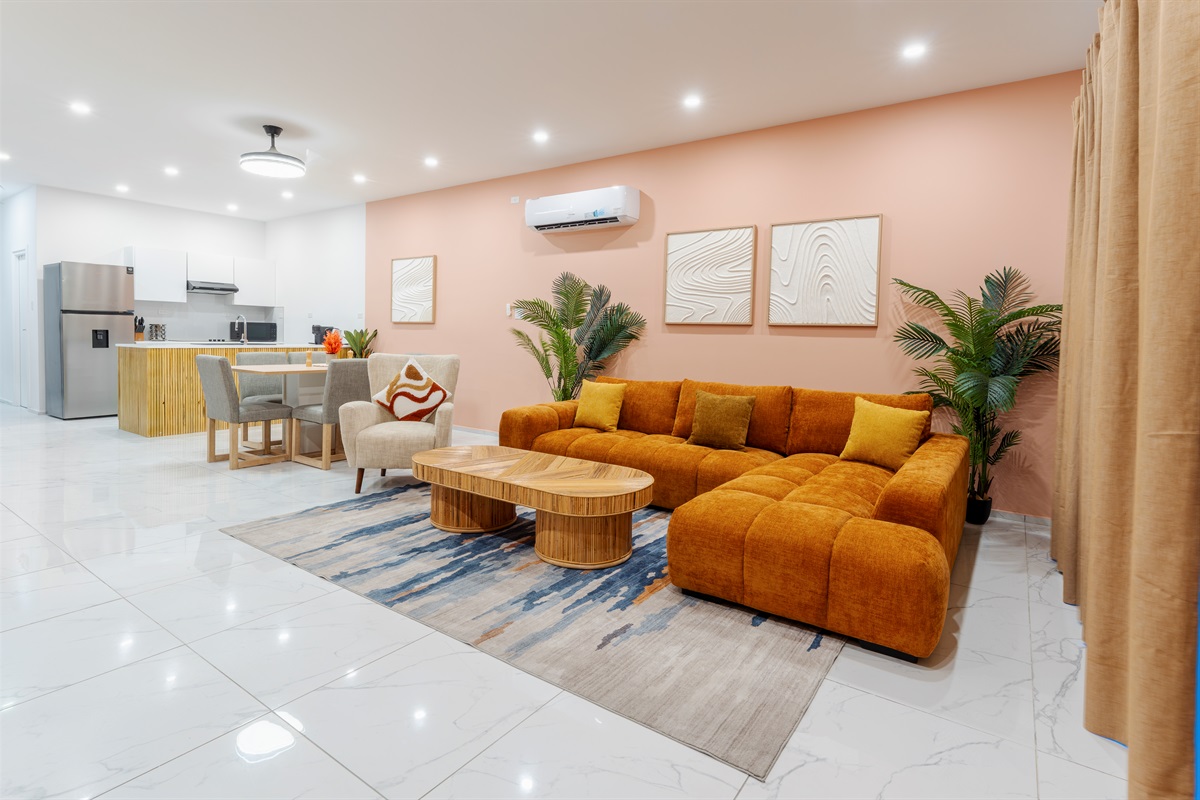 Open-concept view of the main level showing the connection between living, dining and kitchen areas