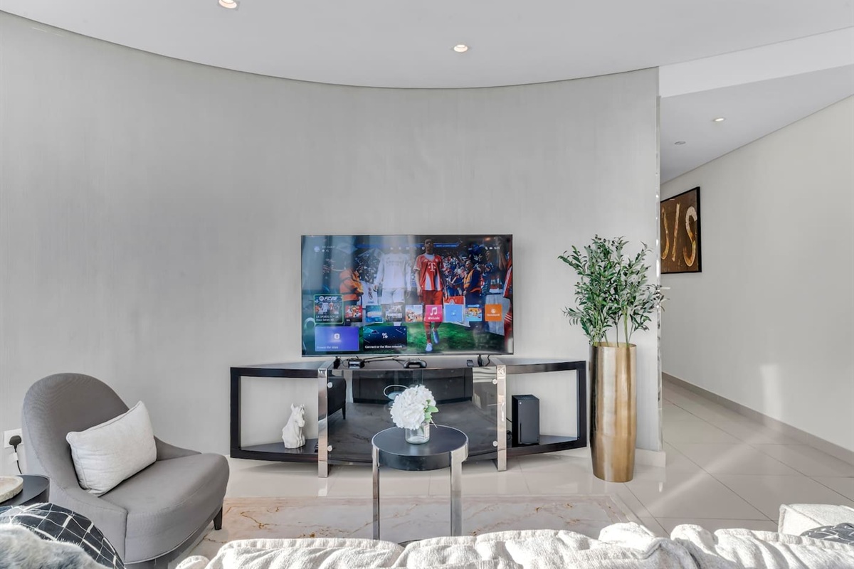 Living room with tv and console Xbox series X console