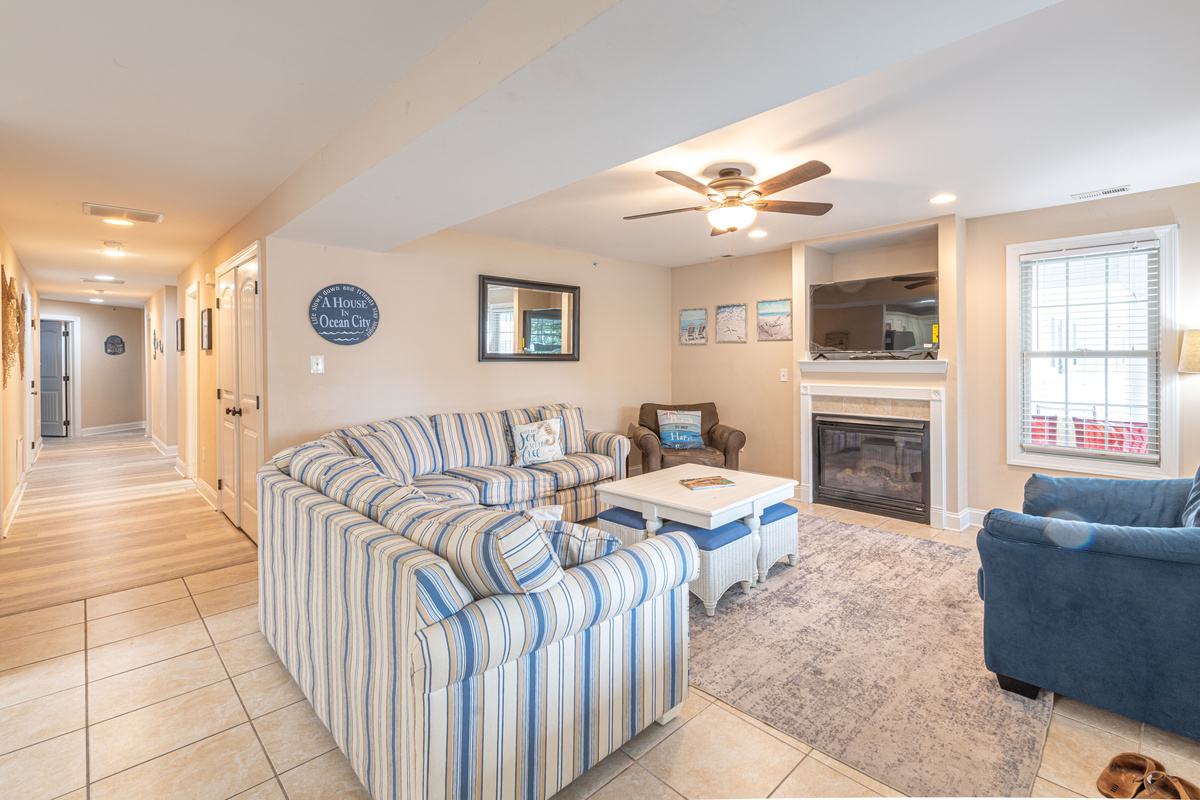 Living Room with Striped Sectional Sofa, Fireplace, and TV