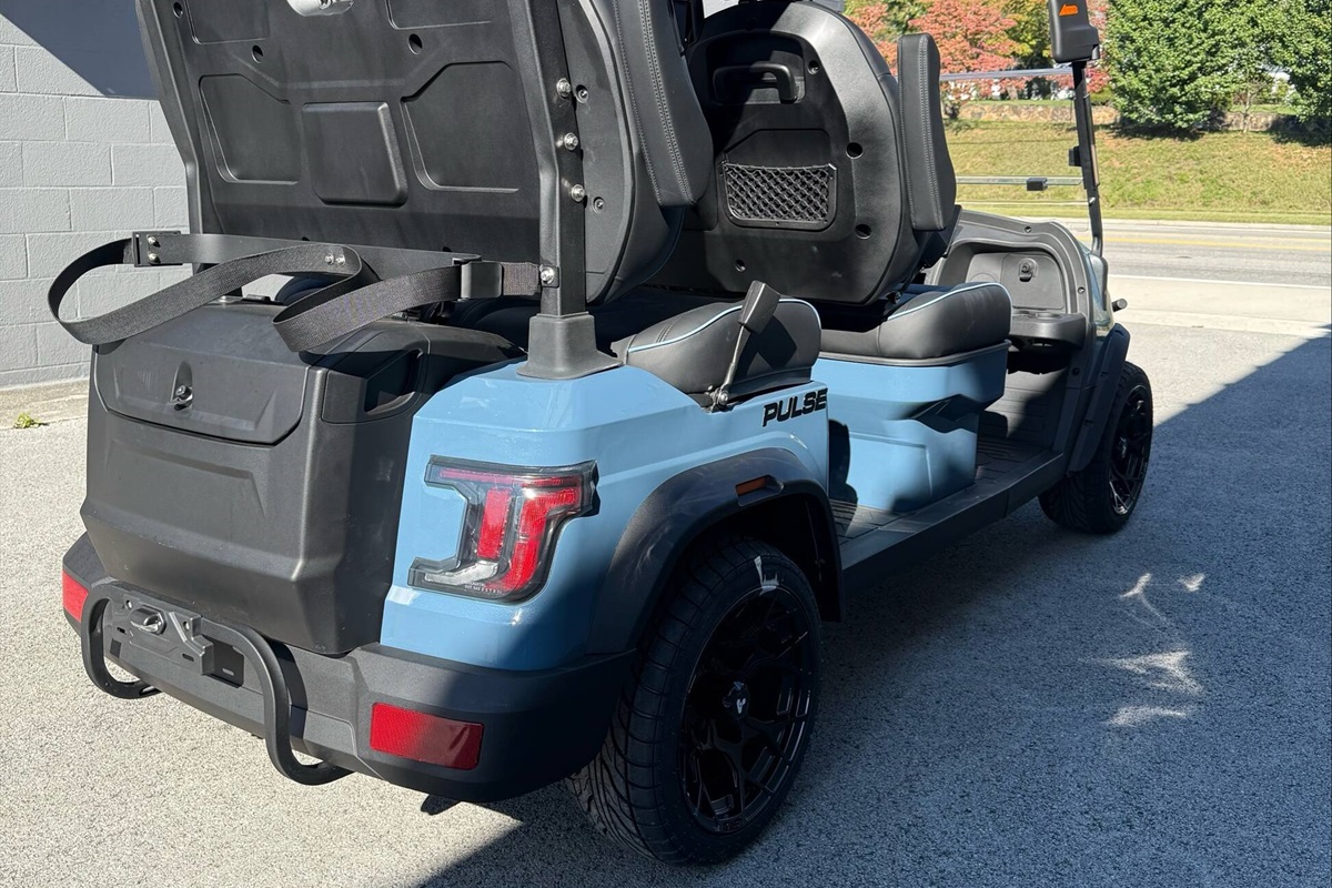 Golf cart has cargo space in back and front