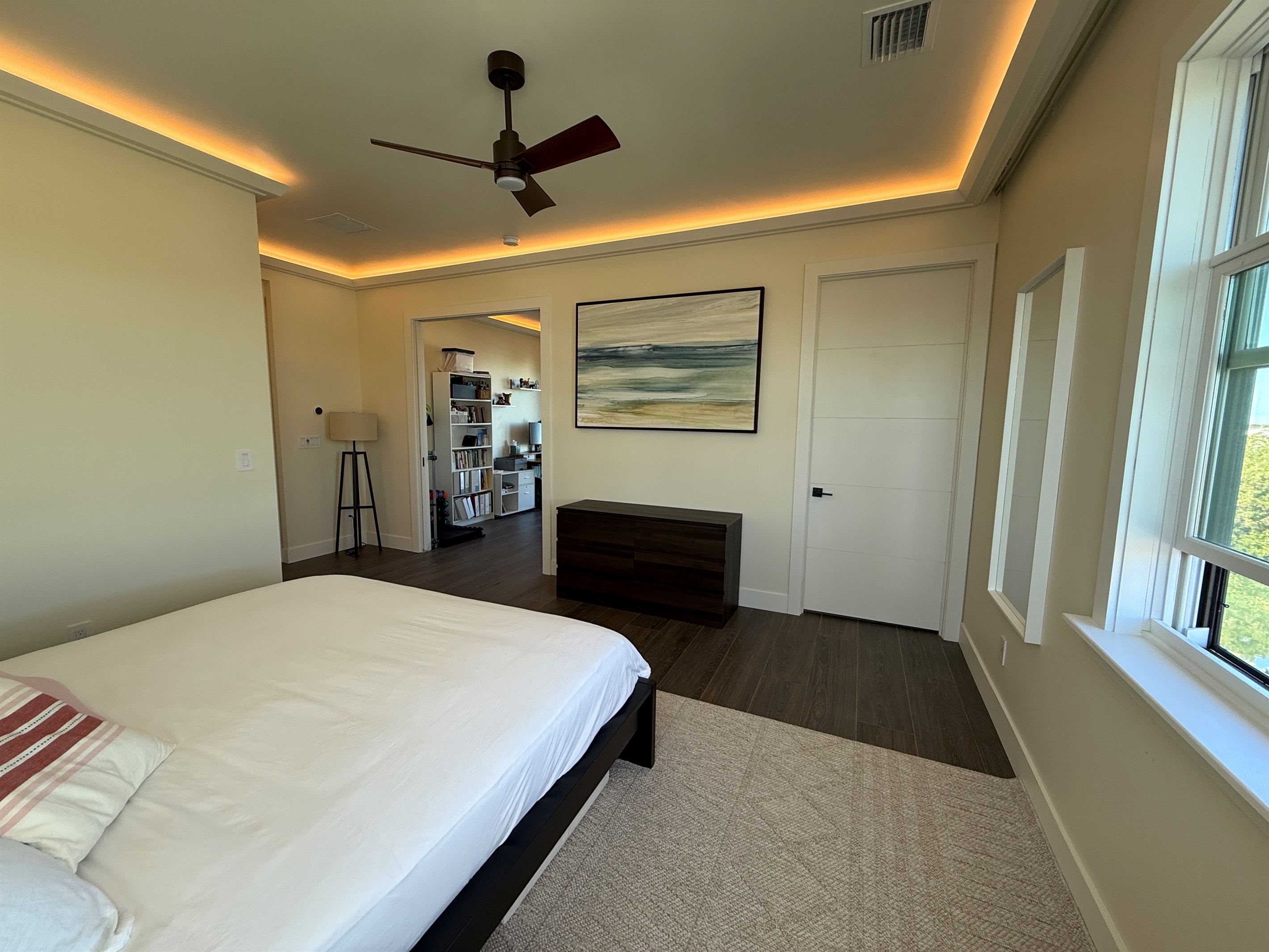 Primary king suite view to en suite bath and office