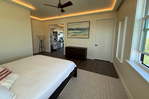 Primary king suite view to en suite bath and office