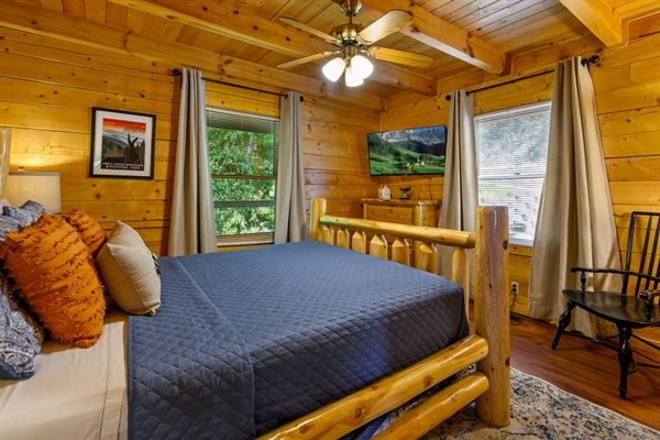 Main floor bedroom with queen size bed and 43" smart tv. 