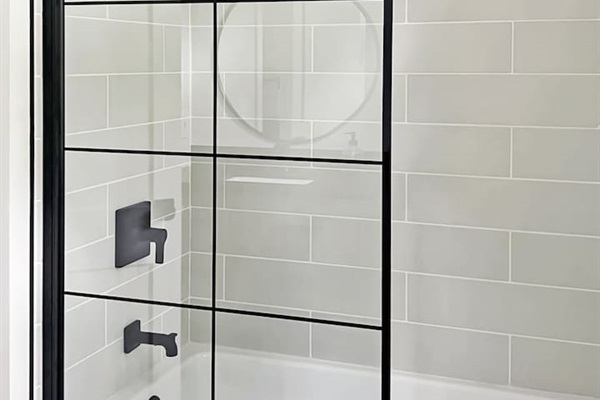 Bathroom with full shower and bathtub off of the main bedroom.