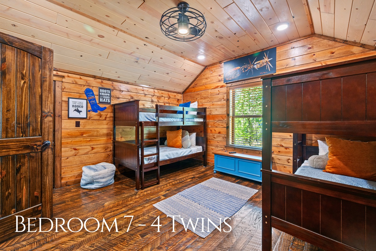 Another bunk room provides a practical and inviting setup, giving guests a comfortable place to rest while still maximizing sleeping space.