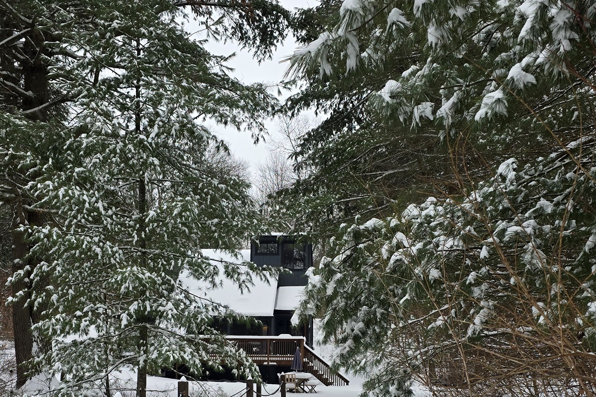 Waking up in a snow globe! Riverfront Retreat is wrapped in winter magic and tucked among the trees