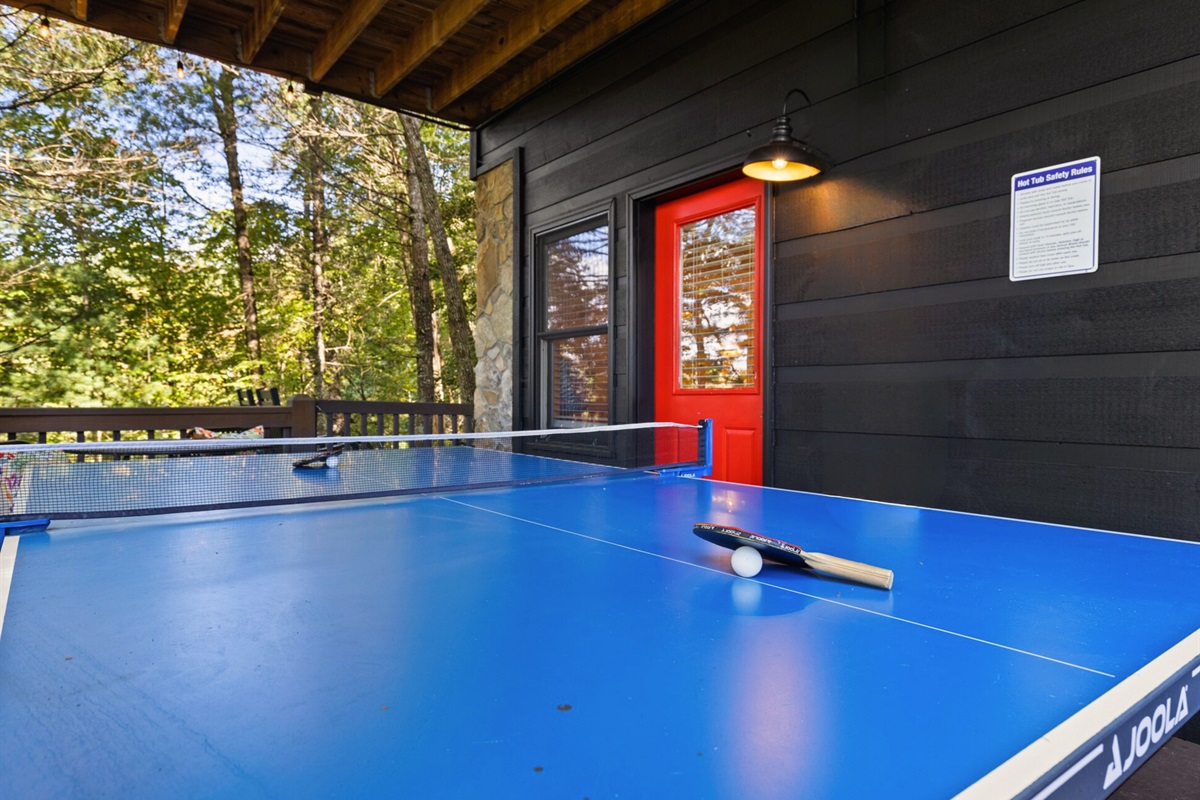Friendly competition under the mountain sky, ping pong with a view.