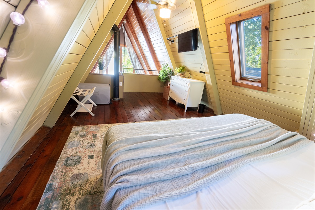 Casper mattress, Nightstand USB ports and fun string lights make the loft bedroom a comfortable and fun place to lay your head at night.