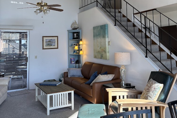 Living area, slider access to back patio. Stairs to loft bedroom.
