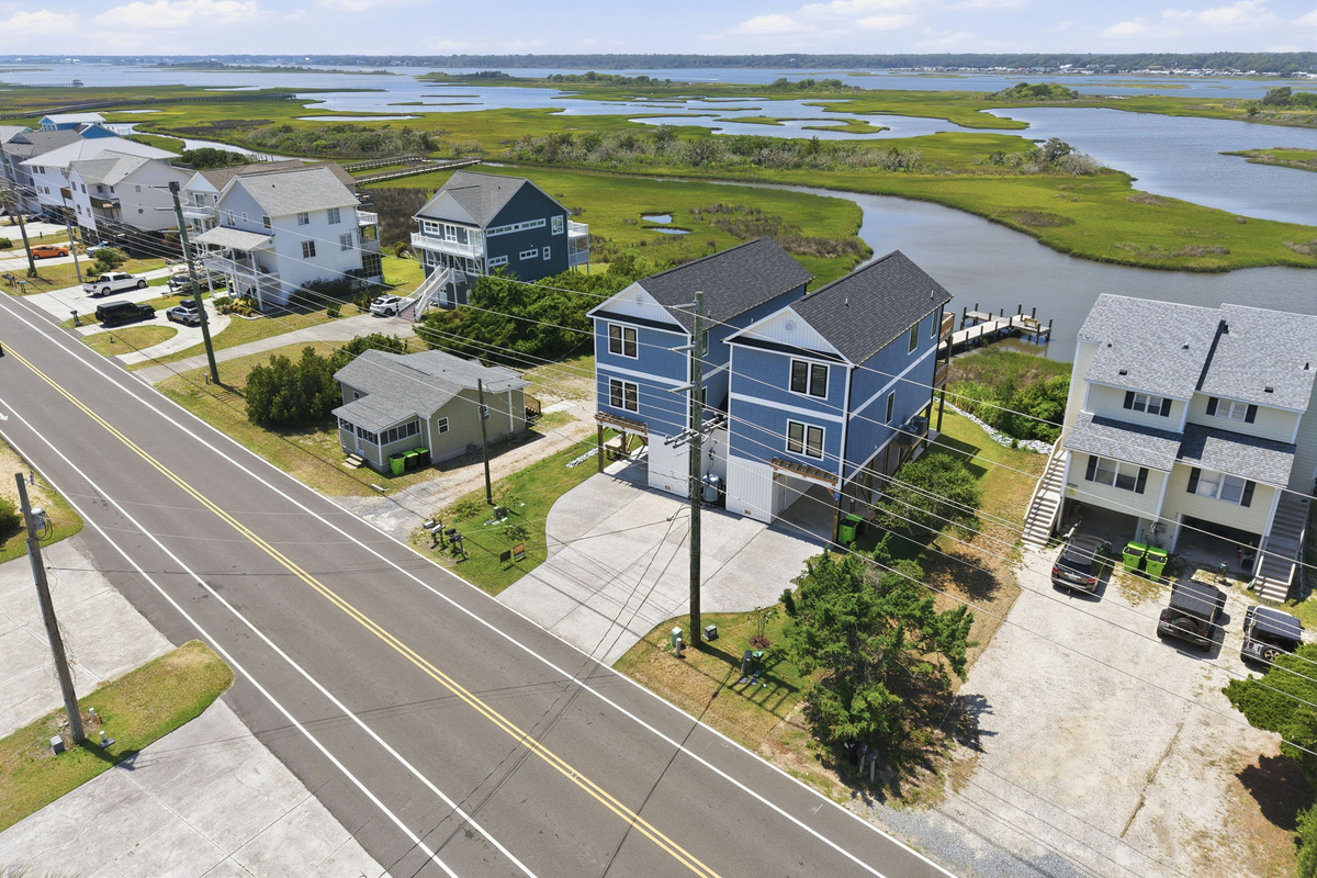 A bird's-eye view showcases the home's prime location on the marsh, complete with a private dock and easy access to the water