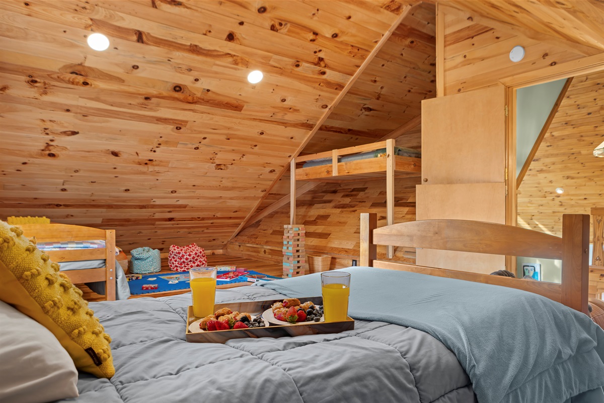 Loft Bedroom 4: Wake up to mountain charm with sunny vibes and playful decor! Perfect for family fun!