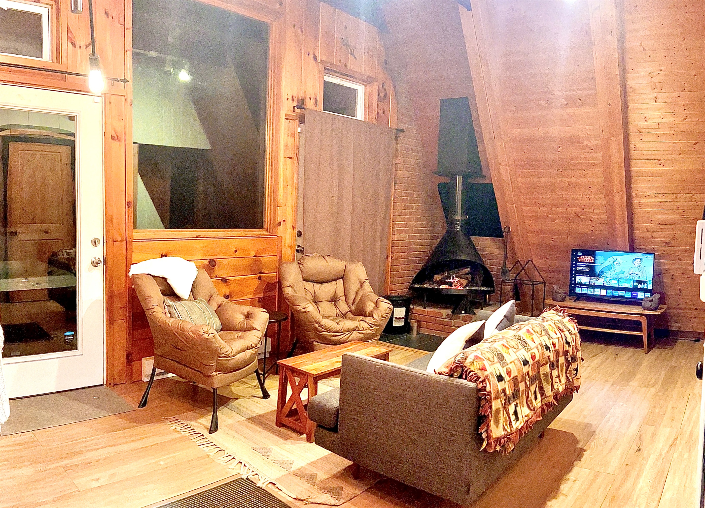 Living Room space with TV and fireplace.