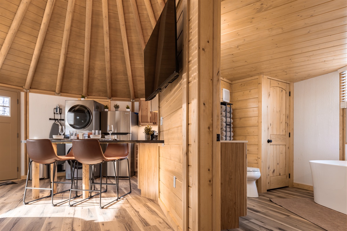 Kitchen bar seating, Smart TV, and easy access to the spa-style bathroom — designed for comfort and flow.