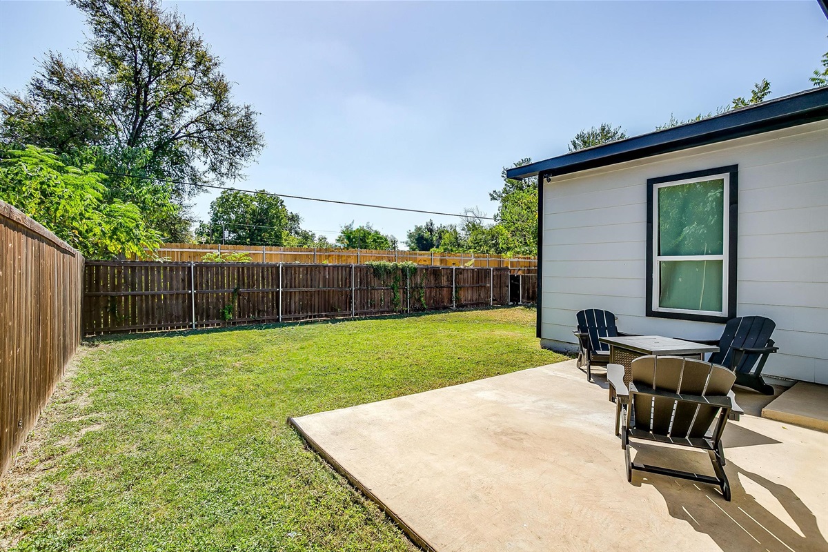 Side patio seating tucked away for quiet reading or WFH moments.