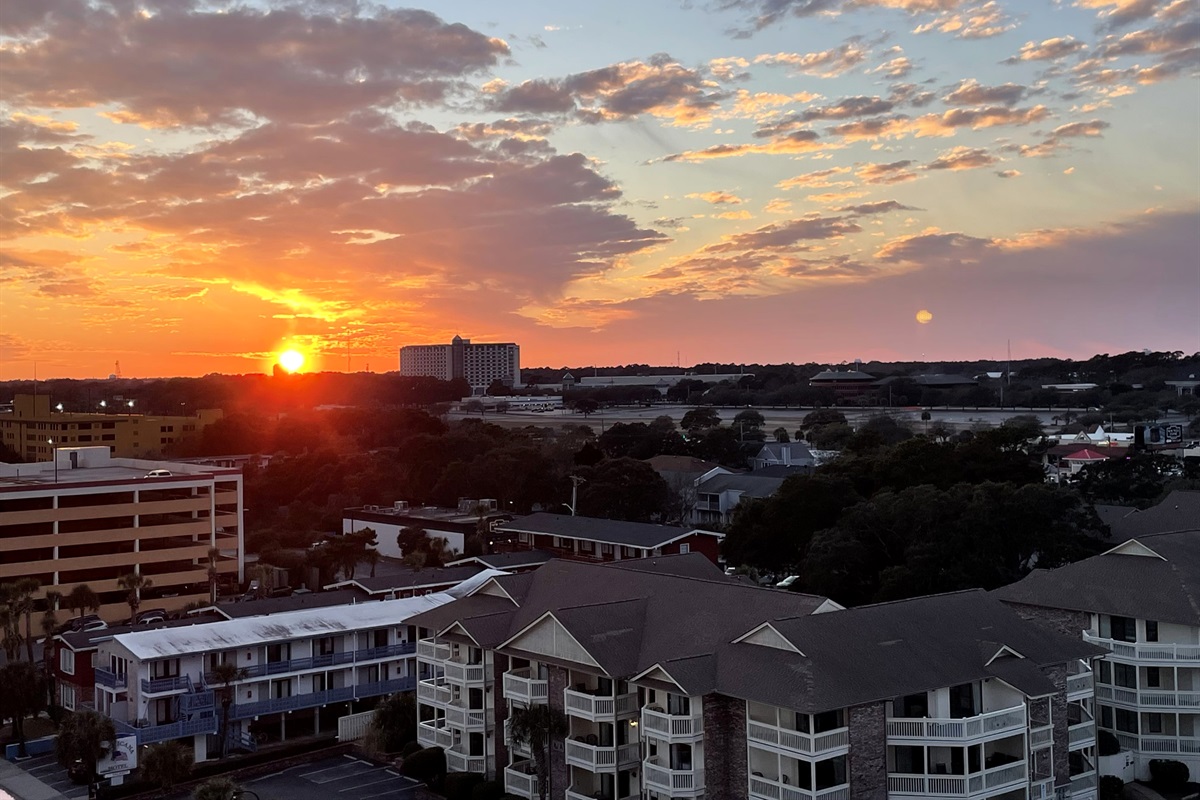 From this cozy nook in the condo, you get a front-row seat to a glowing coastal sunset