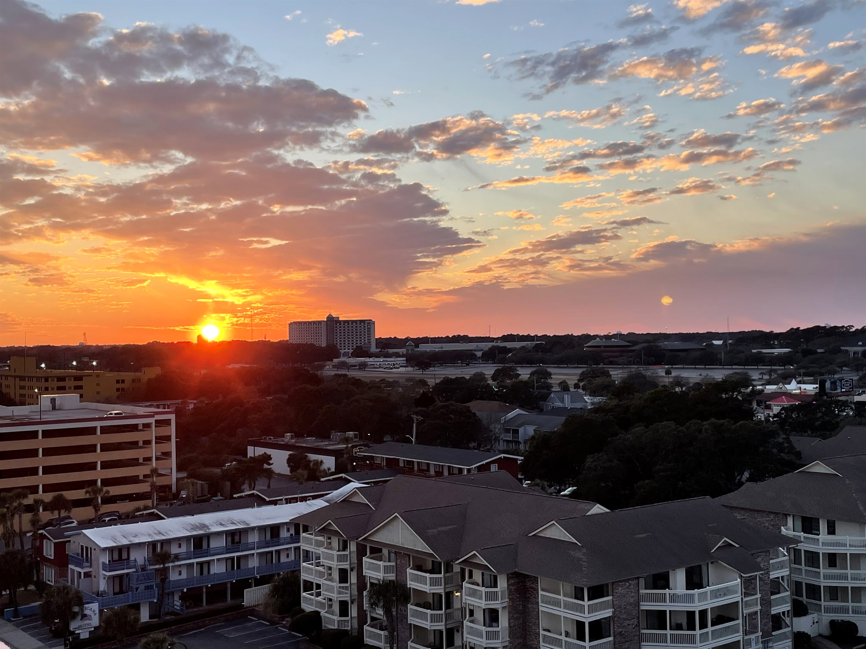 From this cozy nook in the condo, you get a front-row seat to a glowing coastal sunset