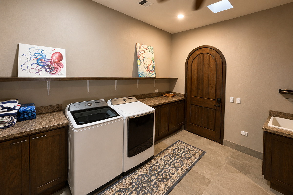 Laundry Room: A full-size washer and dryer, utility sink, iron, garment steamer, vacuum, broom, beach towels, air mattresses, and extra bedding are all conveniently located in the laundry room for your use during your stay.